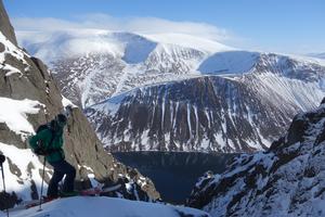 Beast from the East, Sgòr Gaoith and Sgòran Dubh Mòr: Matt Pavitt on top of the boulder on the left hand side of the gully in 2018 Photo: Scott Muir