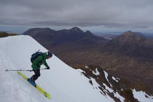 Glas Toll a' Bothain, Liathach: Glas-Toll a' Bothain: Dave Anderson setting off, with Beinn Alligin in the background. Photo: Scott Muir