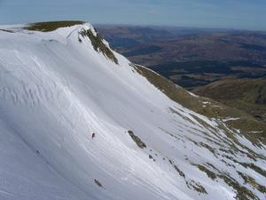 Summit Gully, Aonach Mor: Descending Summit Gully, with 'Spikes' in the background Photo: Scott Muir