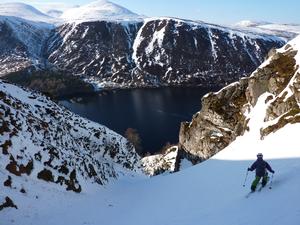 The Ruch Gruip, Loch Muick Basin: Skiiing in a fine position above Loch Muick. Photo: Scott Muir