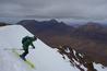 Dave Anderson setting off, with Beinn Alligin in the background.  Photo: Scott Muir