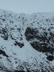 B Gully from the entrance to the corrie, February 2014.  X marks the spot on the arete, with the black dotted line indicating a possible way to avoid the ice pitch.  Photo: Scott Muir