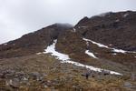 Heading for the tongue of snow extending out of the mouth of the gully  Photo: Scott Muir