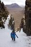 Steve Clark climbing up the lower reaches of the gully  Photo: Scott Muir