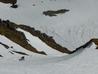 In the shallow gully left of the snow arete  Photo: Scott Muir