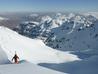 Ascending the final ridge to the summit.   The North-East face and lost valley are below.  Photo: Scott Muir