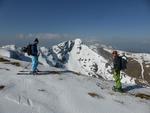 The East face takes the prominent slope below the summit in the sunshine  Photo: Scott Muir