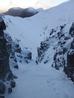 Below the wreckage, heading for the bend in the gully.  Photo: Scott Muir