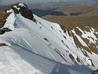 Looking across the face from the top of Central Gully, to Central Direct, and the Upper Snowfield (other side of the rocky outcrop)  Photo: Scott Muir